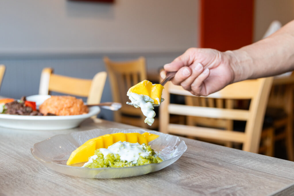 Sweet mango sticky rice with creamy coconut sauce, soft rice, and ripe mango, classic Thai dessert delight