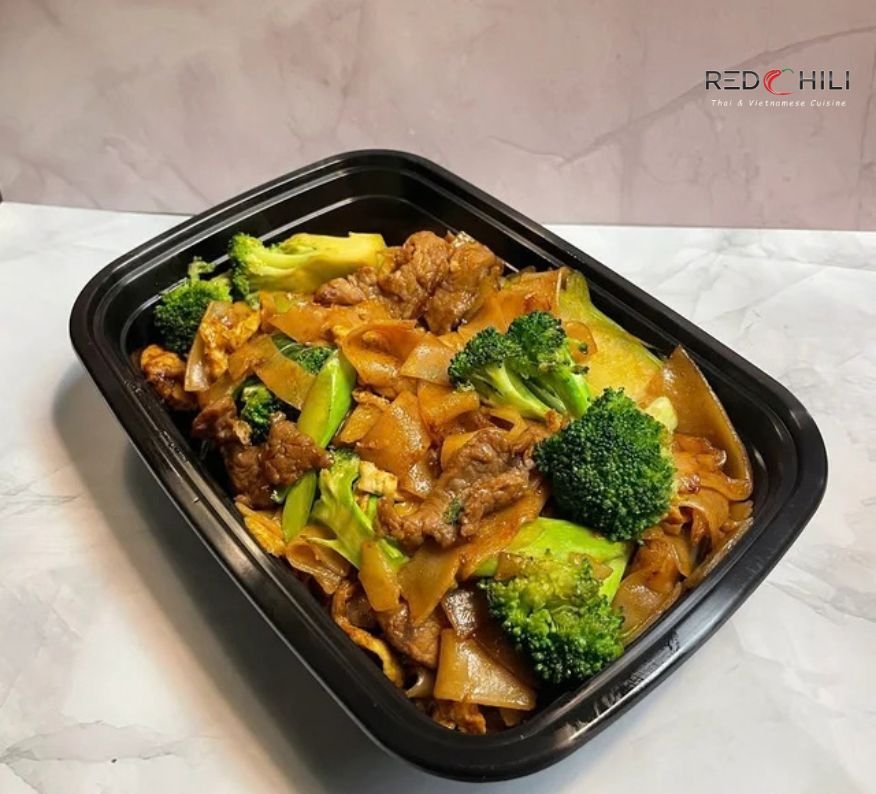 Pad See Ew Thai stir-fried noodles with vegetables and beef